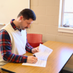 Chase preparing for the next lecture. Guadalupe Centers